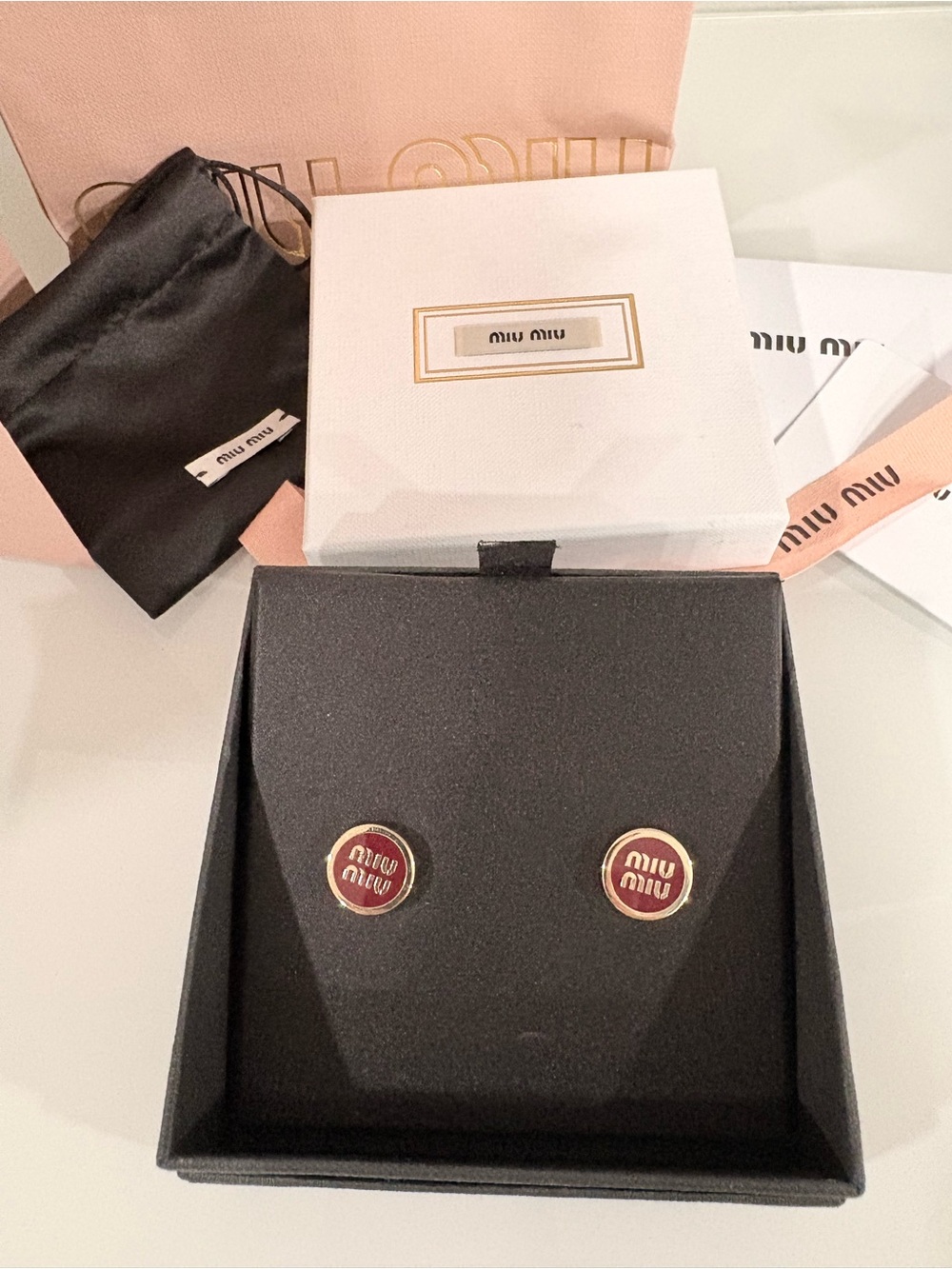 Authentic Miu Miu enameled earrings in Amaranth red Preowned